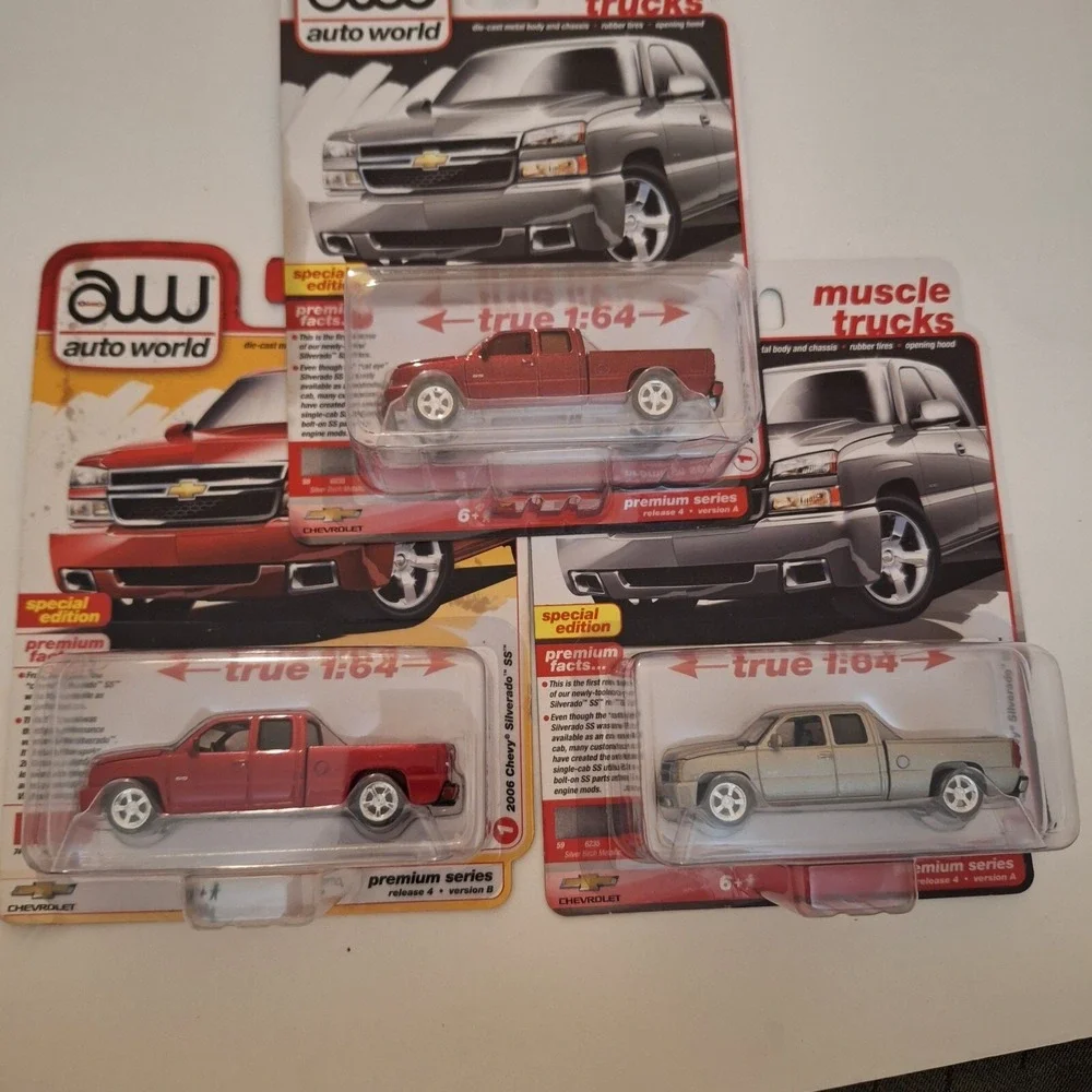 2024 AUTO WORLD Muscle Trucks 2006 Chevy Silverado SS Silver,Red + Ultra Red Lot